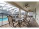 Covered patio with seating area overlooking the pool at 4562 Narrative Ln, Kissimmee, FL 34746