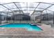 Inviting pool and spa area with a covered patio at 4562 Narrative Ln, Kissimmee, FL 34746