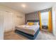 King-size bed, stylish decor, and an ensuite bathroom at 4562 Narrative Ln, Kissimmee, FL 34746