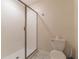 Clean bathroom with shower, toilet and tile flooring at 4562 Narrative Ln, Kissimmee, FL 34746