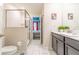 Modern bathroom with walk-in shower and double vanity at 4562 Narrative Ln, Kissimmee, FL 34746