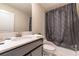 Clean bathroom with tub shower and dark vanity at 4562 Narrative Ln, Kissimmee, FL 34746