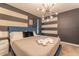 Comfortable bedroom with a king-size bed and unique decor at 4562 Narrative Ln, Kissimmee, FL 34746