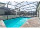 Relaxing screened pool and spa with paved patio at 4562 Narrative Ln, Kissimmee, FL 34746