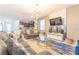 Bright and airy living room with modern decor and large windows at 4562 Narrative Ln, Kissimmee, FL 34746