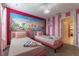 Charming bedroom with twin beds and a Disney princess mural at 4562 Narrative Ln, Kissimmee, FL 34746