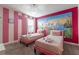 Charming bedroom with twin beds and a Disney princess mural at 4562 Narrative Ln, Kissimmee, FL 34746