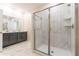 Modern bathroom with walk-in shower and double vanity at 4562 Narrative Ln, Kissimmee, FL 34746