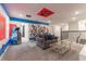 Game room with Marvel theme, comfortable seating and mural at 4562 Narrative Ln, Kissimmee, FL 34746