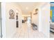 Bright and spacious entryway with tile flooring and bench at 4562 Narrative Ln, Kissimmee, FL 34746