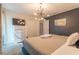 Spacious bedroom with a large bed, dresser, and TV at 4562 Narrative Ln, Kissimmee, FL 34746