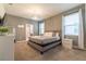 Spacious bedroom with king-size bed and en-suite bathroom at 4562 Narrative Ln, Kissimmee, FL 34746