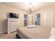 Spacious bedroom with a king-size bed and TV at 4562 Narrative Ln, Kissimmee, FL 34746