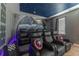 Home theater with space-themed decor and projector at 4562 Narrative Ln, Kissimmee, FL 34746