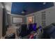 Home theater with a large screen and comfortable seating at 4562 Narrative Ln, Kissimmee, FL 34746