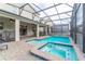 Stunning pool and spa with covered patio and lounge chairs at 4562 Narrative Ln, Kissimmee, FL 34746