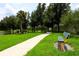 Scenic walking path with bench and lush landscaping at 540 Seven Oaks Blvd, Winter Springs, FL 32708