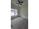 Spacious bedroom with carpeted floor and ceiling fan at 555 Sanctuary Golf Pl, Apopka, FL 32712