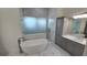 Spa-like bathroom with a freestanding tub and walk-in shower at 555 Sanctuary Golf Pl, Apopka, FL 32712