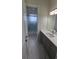 Bathroom with gray vanity and a shower/tub combo at 555 Sanctuary Golf Pl, Apopka, FL 32712