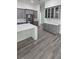 Modern kitchen with gray cabinets, white countertops, and an island at 555 Sanctuary Golf Pl, Apopka, FL 32712