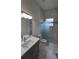 Modern bathroom with marble flooring and a glass shower at 555 Sanctuary Golf Pl, Apopka, FL 32712