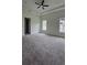 Spacious bedroom with carpeted floors and ceiling fan at 555 Sanctuary Golf Pl, Apopka, FL 32712