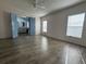 Main bedroom with ensuite bathroom and wood-look floors at 550 Saint Johns Rd, Tavares, FL 32778