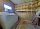 Laundry room with washer, dryer, and ample shelving at 550 Saint Johns Rd, Tavares, FL 32778