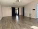 Living room showcases wood-look floors and access to a screened porch at 550 Saint Johns Rd, Tavares, FL 32778