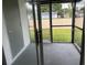 Screened porch with sliding glass door and access to backyard at 5817 Willow Bud Ct # 5817, Orlando, FL 32807