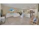 Open living room with L-shaped sofa and view into kitchen at 2854 Black Birch Dr, Ocoee, FL 34761