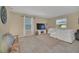 Living room with white sectional sofa and large TV at 2854 Black Birch Dr, Ocoee, FL 34761