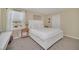 Bright bedroom with a queen-size bed and neutral decor at 2854 Black Birch Dr, Ocoee, FL 34761