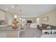 Open concept kitchen with island, looking toward living room at 2854 Black Birch Dr, Ocoee, FL 34761
