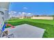 Spacious backyard with a patio and grassy area at 2854 Black Birch Dr, Ocoee, FL 34761