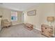 Cozy loft area, perfect for relaxation, with a comfortable chair and small table at 2854 Black Birch Dr, Ocoee, FL 34761