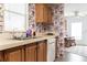 Kitchen with wood cabinets, double sink, and dishwasher at 550 Saint Johns Rd, Tavares, FL 32778