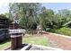 Scenic walkway to marina park with lush landscaping and charming nautical decor at 550 Saint Johns Rd, Tavares, FL 32778