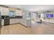 Open concept kitchen with island and breakfast nook at 8903 Stinger Dr, Davenport, FL 33896