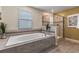 Bathroom with soaking tub and walk-in shower at 8903 Stinger Dr, Davenport, FL 33896
