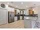 Modern kitchen with stainless steel appliances and white cabinetry at 8903 Stinger Dr, Davenport, FL 33896