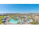 Aerial view of community pool and surrounding homes at 8903 Stinger Dr, Davenport, FL 33896