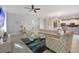 Living area with sectional sofa, coffee table and accent chair at 8903 Stinger Dr, Davenport, FL 33896
