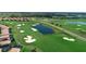 Golf course with water features and luxury homes at 8903 Stinger Dr, Davenport, FL 33896
