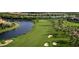 Golf course with water features and luxury homes at 8903 Stinger Dr, Davenport, FL 33896