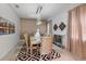 Formal dining room with gold-toned chairs and a statement chandelier at 8903 Stinger Dr, Davenport, FL 33896