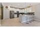 Kitchen boasts stainless steel appliances and breakfast bar at 8903 Stinger Dr, Davenport, FL 33896