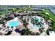 Expansive community pool with various lounging areas at 8903 Stinger Dr, Davenport, FL 33896