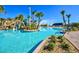 Expansive resort-style pool with waterslide and lush landscaping at 8903 Stinger Dr, Davenport, FL 33896